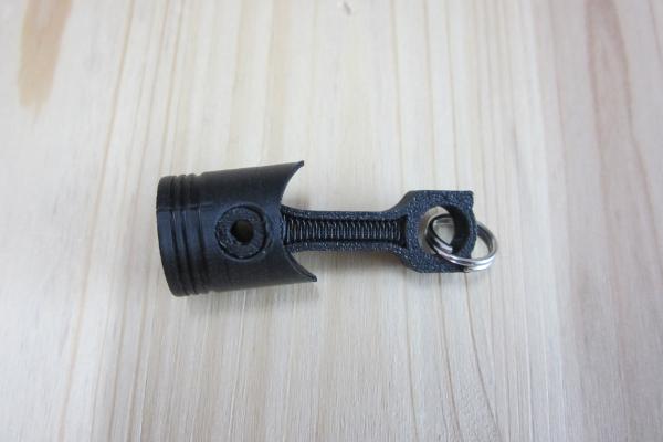 Schlüsselanhänger Kolben